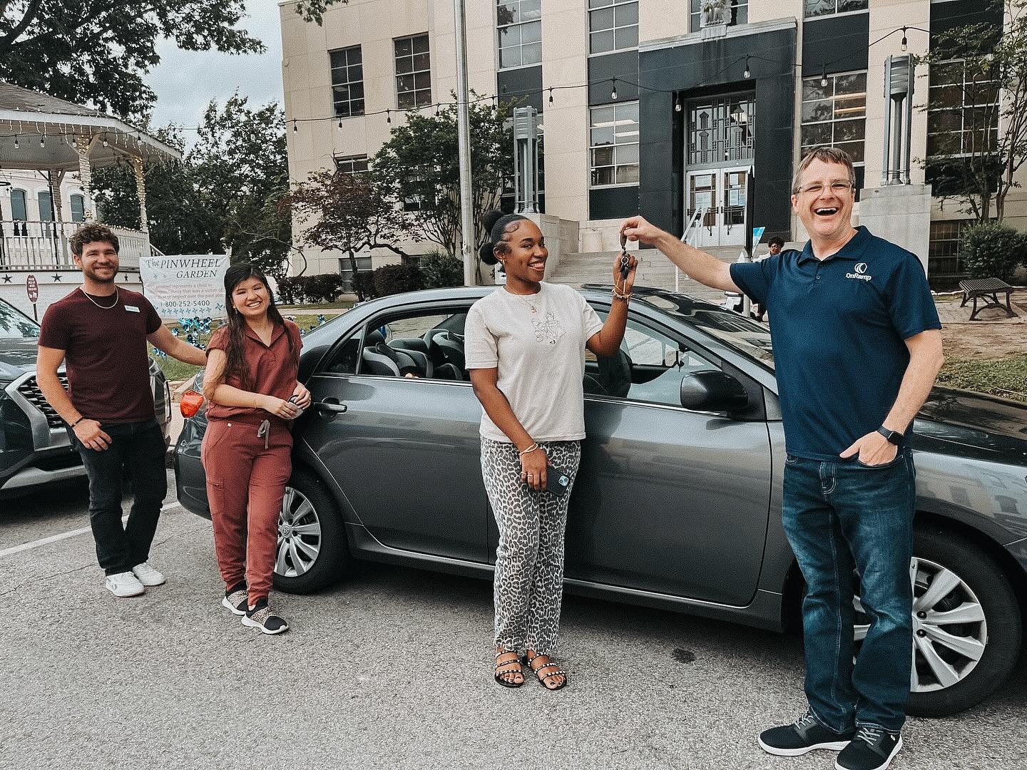 OnRamp team handing keys to a client